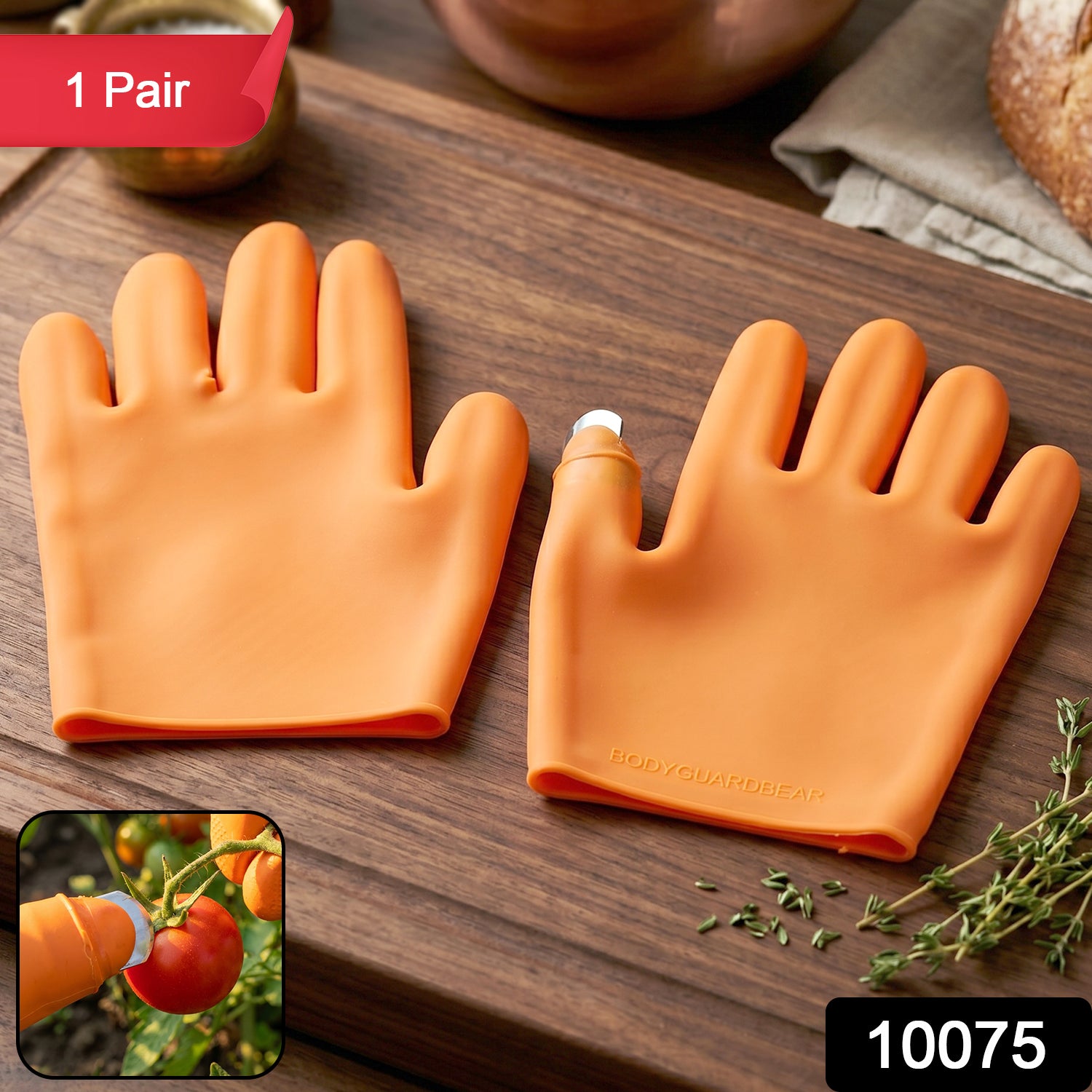 Close-up of thumb knife protector on silicone gloves in bright orange