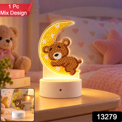The teddy bear and moon diamond painting night light on a wooden bedside table, with a blurred teddy bear and pink bedding