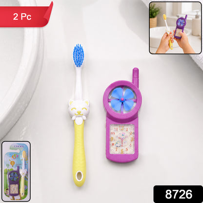 Close-up of a blue kids cartoon toothbrush with a fan toy
