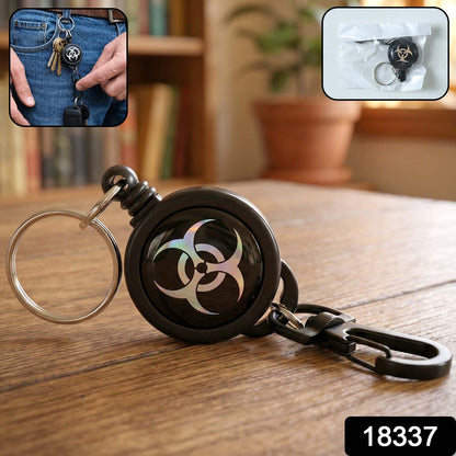 Close-up of retractable keychain clip with keys attached