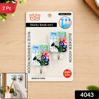 Retail packaging for two decorative sticky hooks with floral designs, showcasing product details and a small inset image.