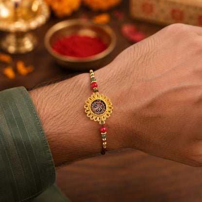 Hand Painted Ganesha Medallion Rakhi with Red Beads