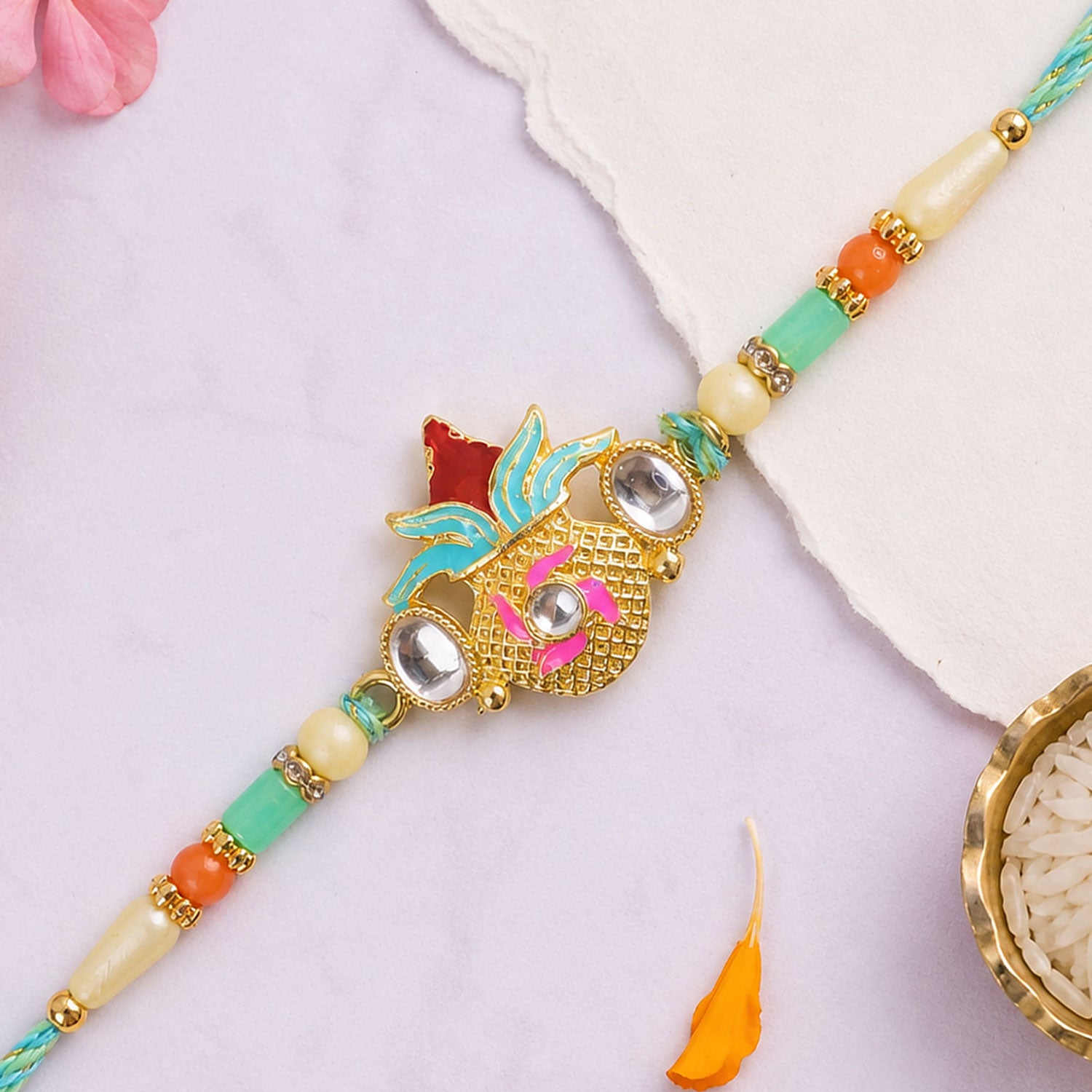 Sacred Nariyal Kalash Golden Metallic Motif Rakhi with Sea Green & Coral Beads
