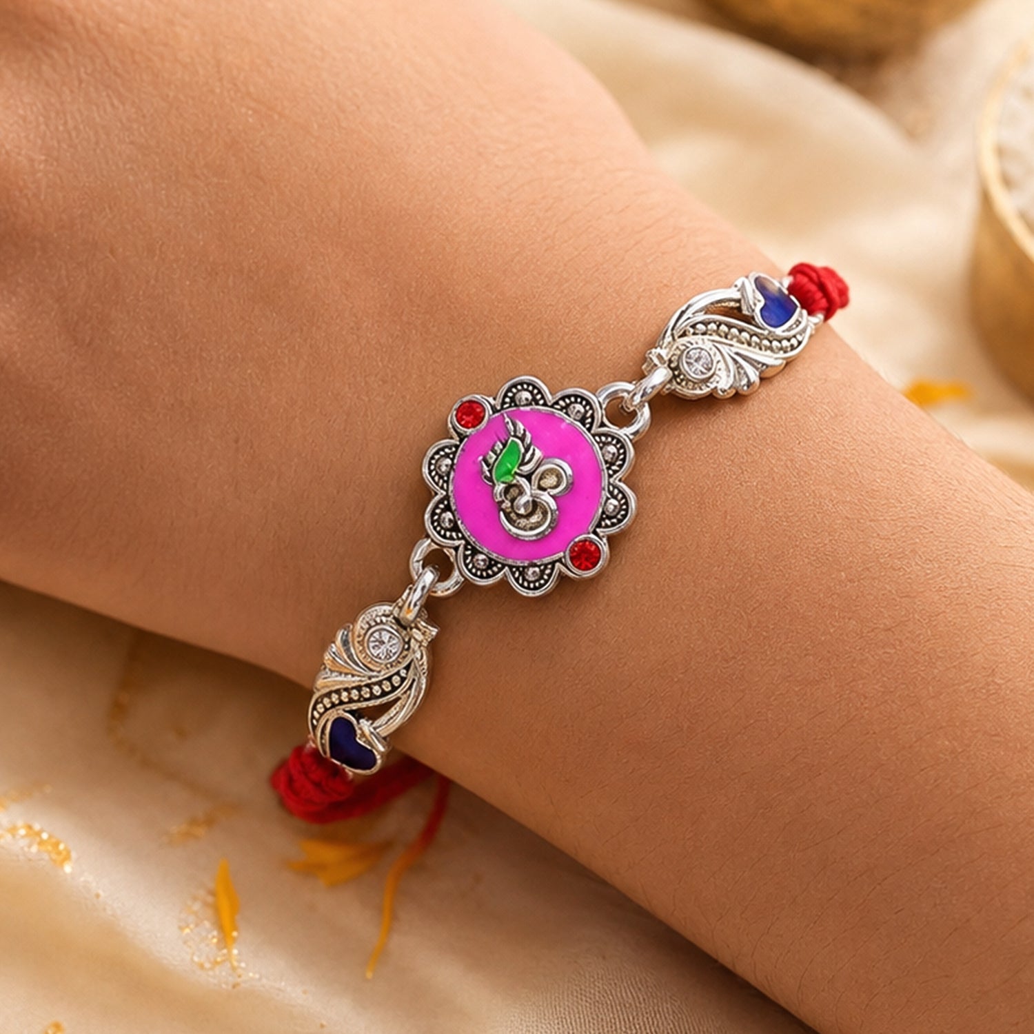 Premium Rakhi featuring Round Floral Medallion, gold trims and chain look for Gift