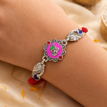 Premium Rakhi featuring Round Floral Medallion, gold trims and chain look for Gift