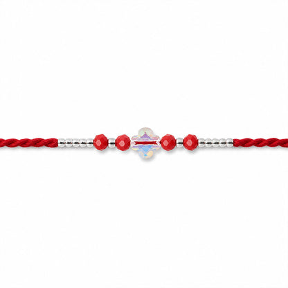 Red Thread Rakhi with Red Beads and an Iridescent Quatrefoil Crystal