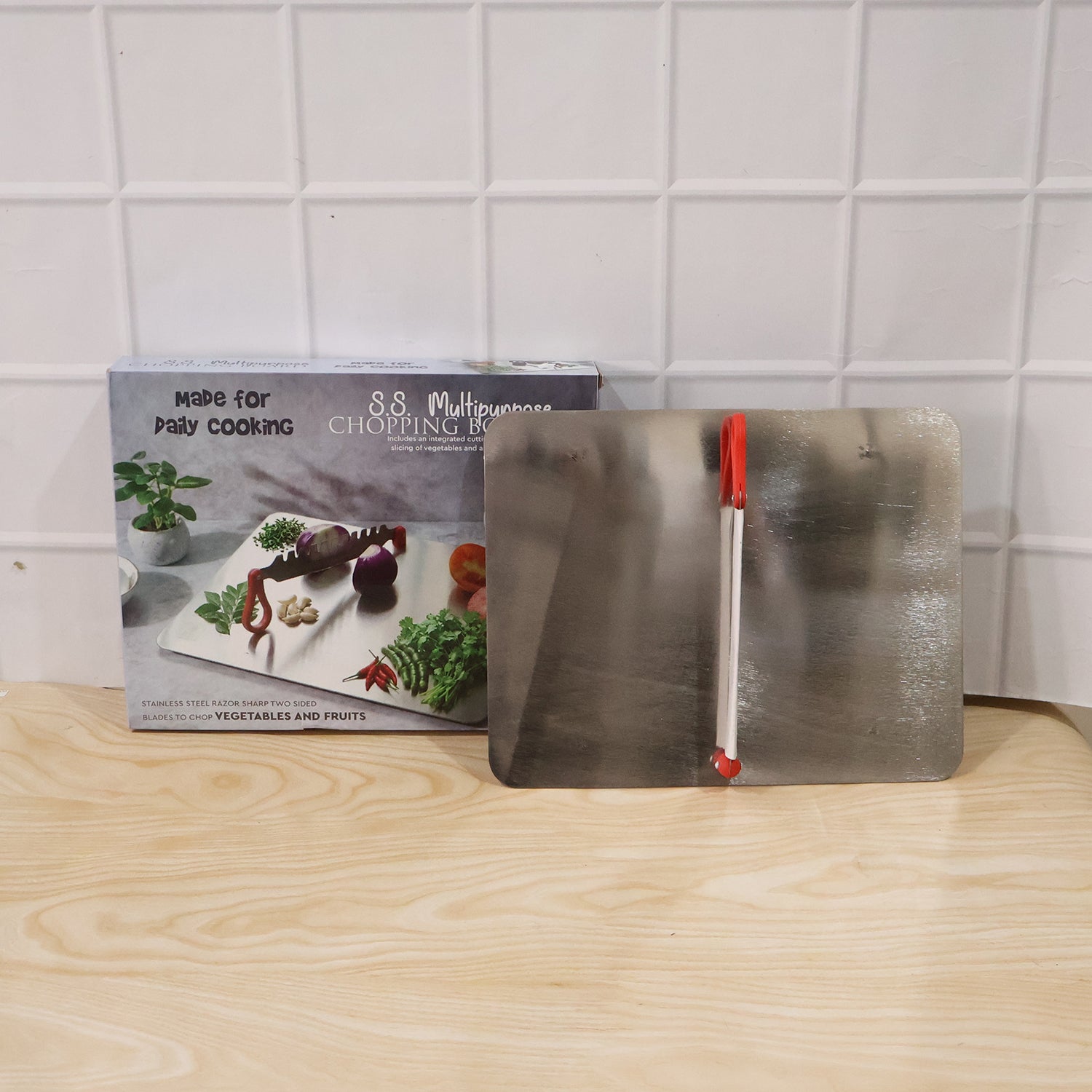 Stainless steel multipurpose chopping board with knife, ideal for clean and efficient kitchen prep.