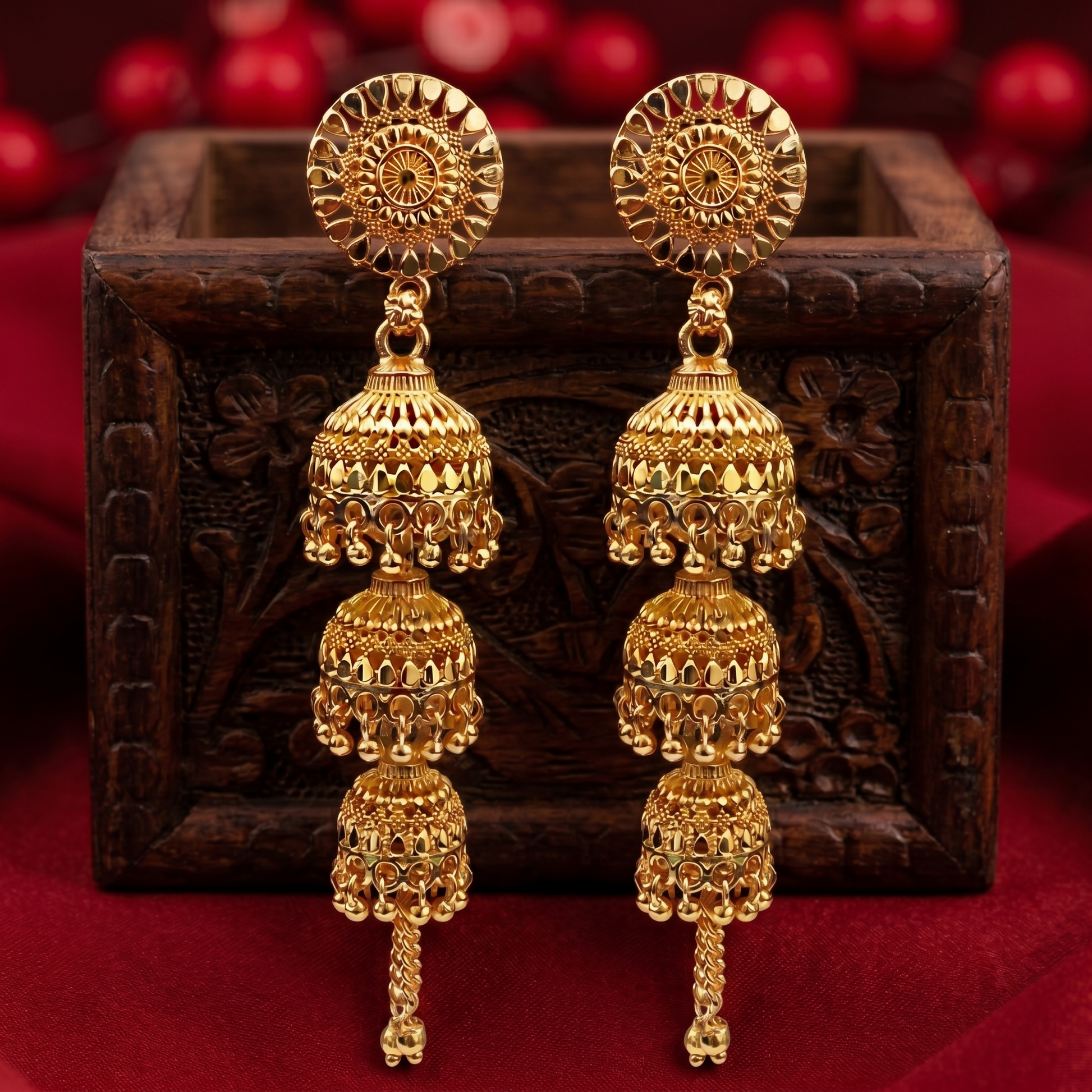 Close-up of intricate gold tone jhumki earring design