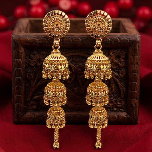 Close-up of intricate gold tone jhumki earring design