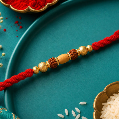 Red Thread Rakhi with a Row of Natural Rudraksha Bead Pendant