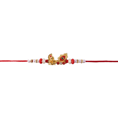 Krishna Mor Pankh Rakhi with Red Pearls and Festive Gold Charm