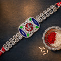 Premium Rakhi showcasing Swastik Charm, gold trims and chain look for Product Display
