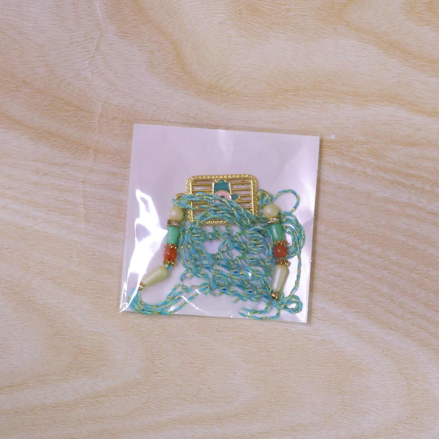 Evil Eye Square Charm Rakhi with Turquoise Beads and Modern Festive Gift Style Ideas