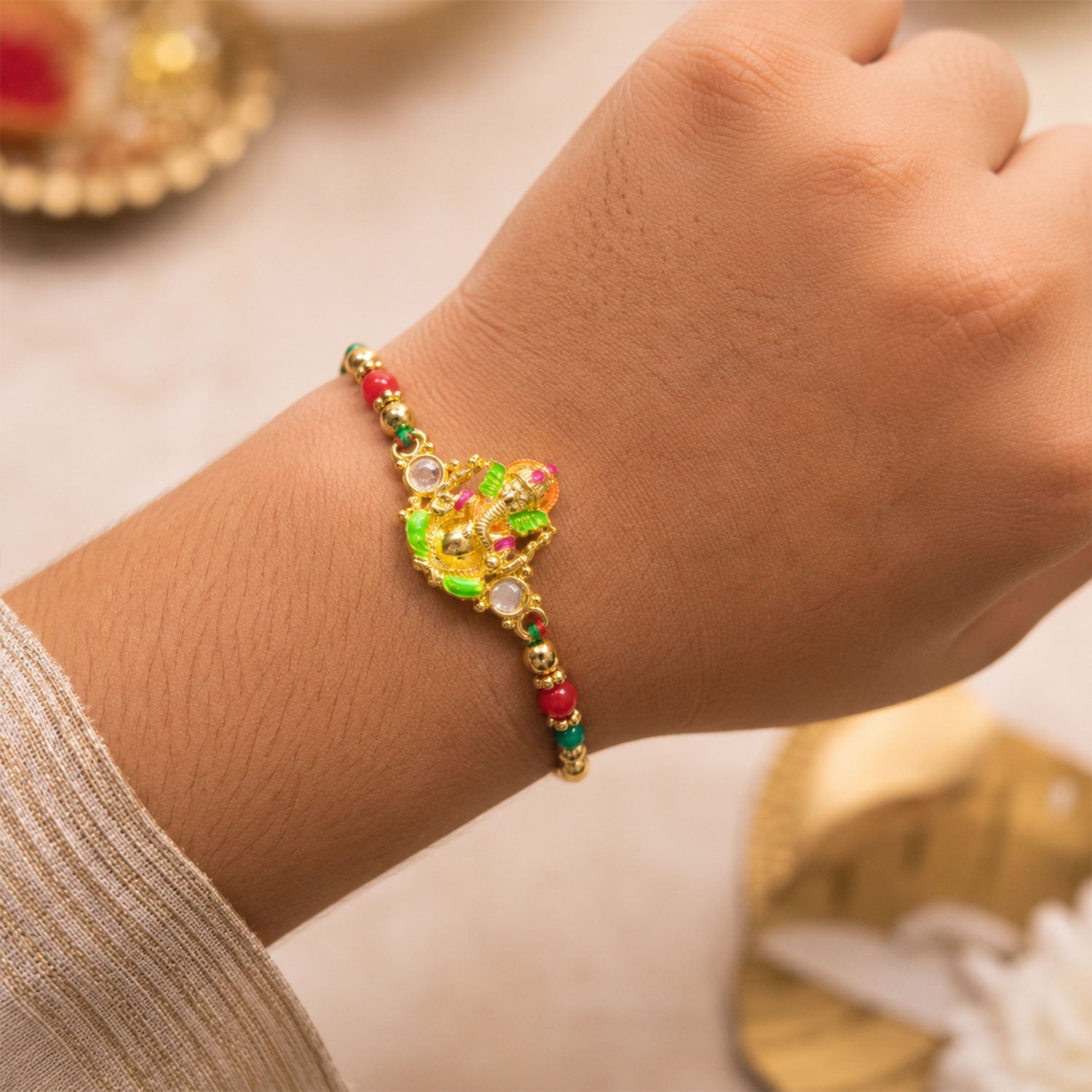 Colorful Ganesh Rakhi with Red Green Beads and Auspicious Festive Gifting Appeal
