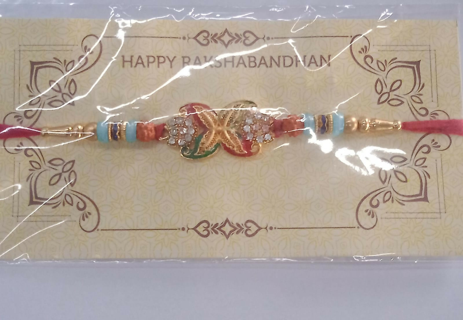Bead Rakhi with Golden Flower Motif Elegant & Festive Sibling Gift (10pcs)