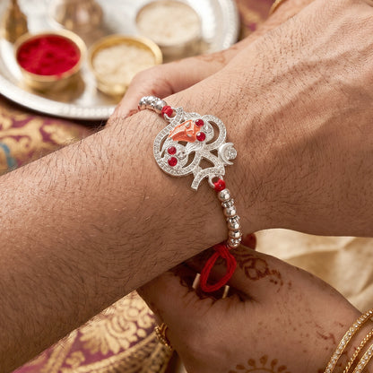 Silver Om Ganesh Rakhi with Red Stones and Metal Bead Chain