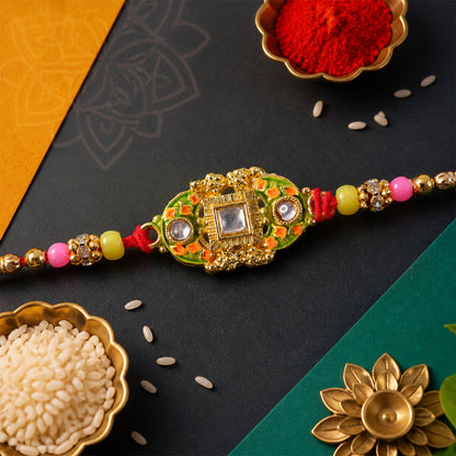 Elegant Rakhi with Square Red Gem Charm and gift finish in ornate look for Gift Use