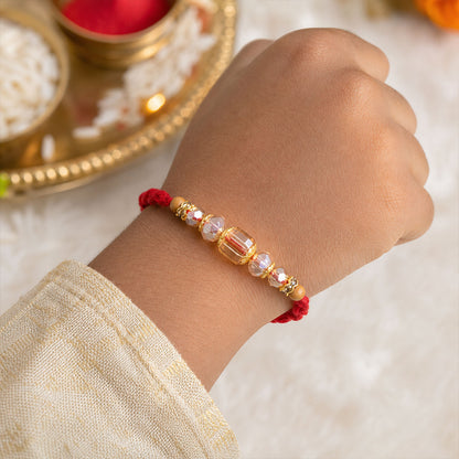 Red Thread Rakhi with Champagne Crystal Beads and Golden Accents