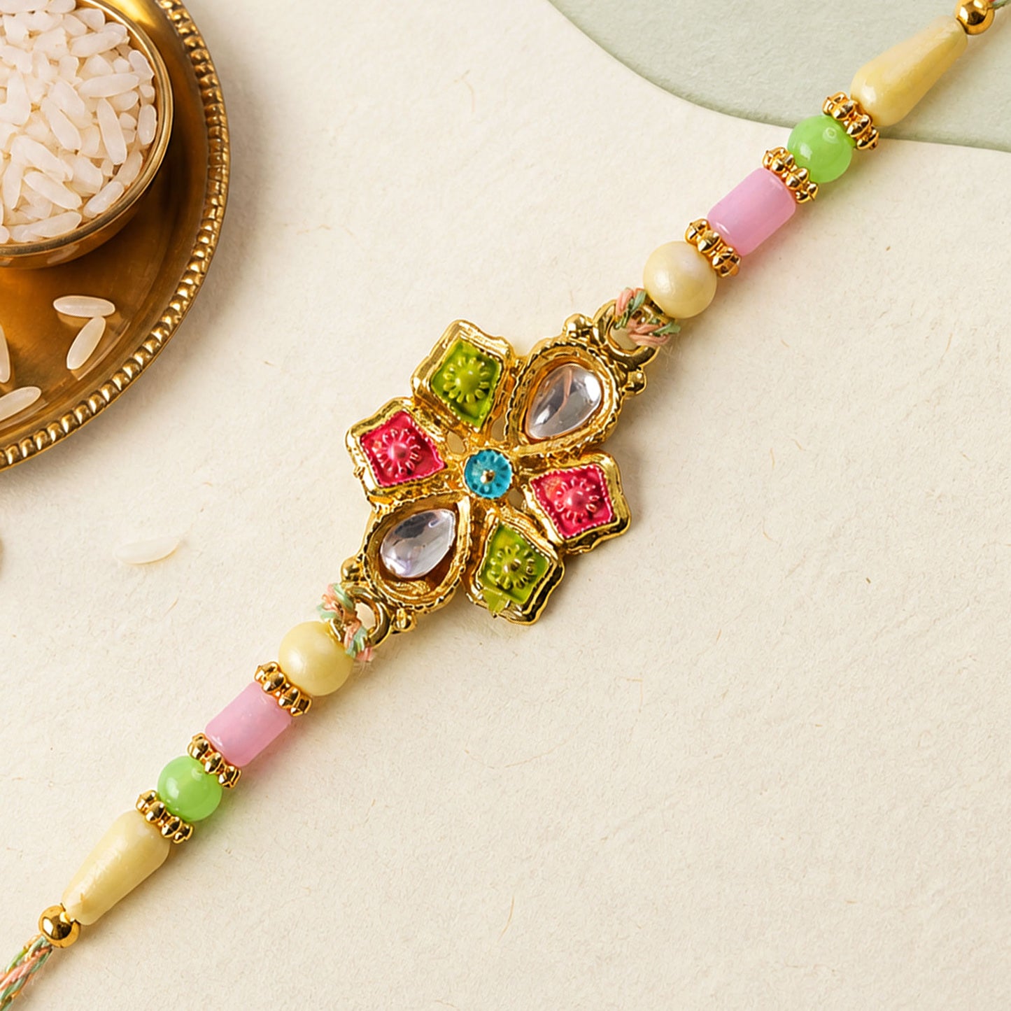 Floral Cross Kundan Pendant Rakhi with Multicolor Beads