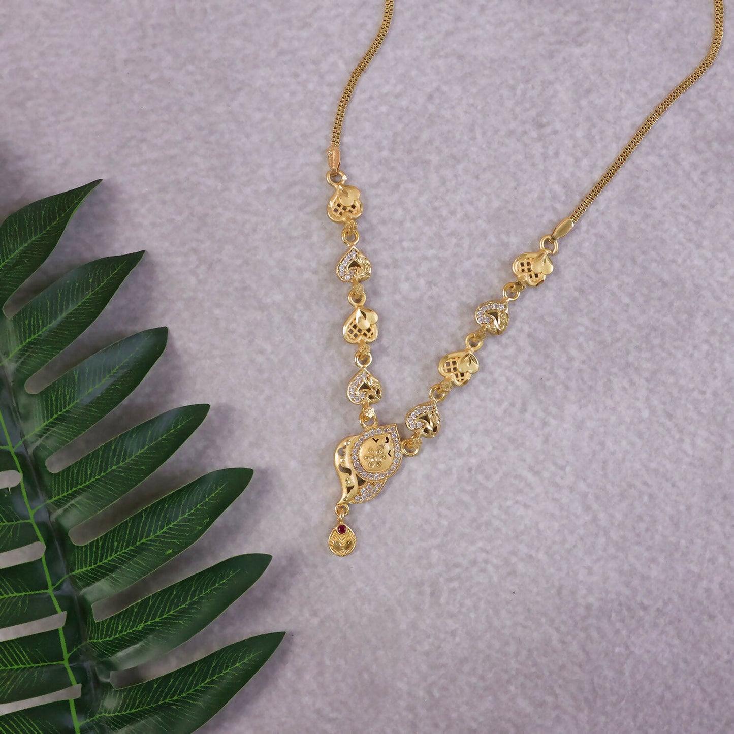Elegant Gold-Tone Heart Motif Necklace Set with Designer Pendant & Matching Drop Earrings