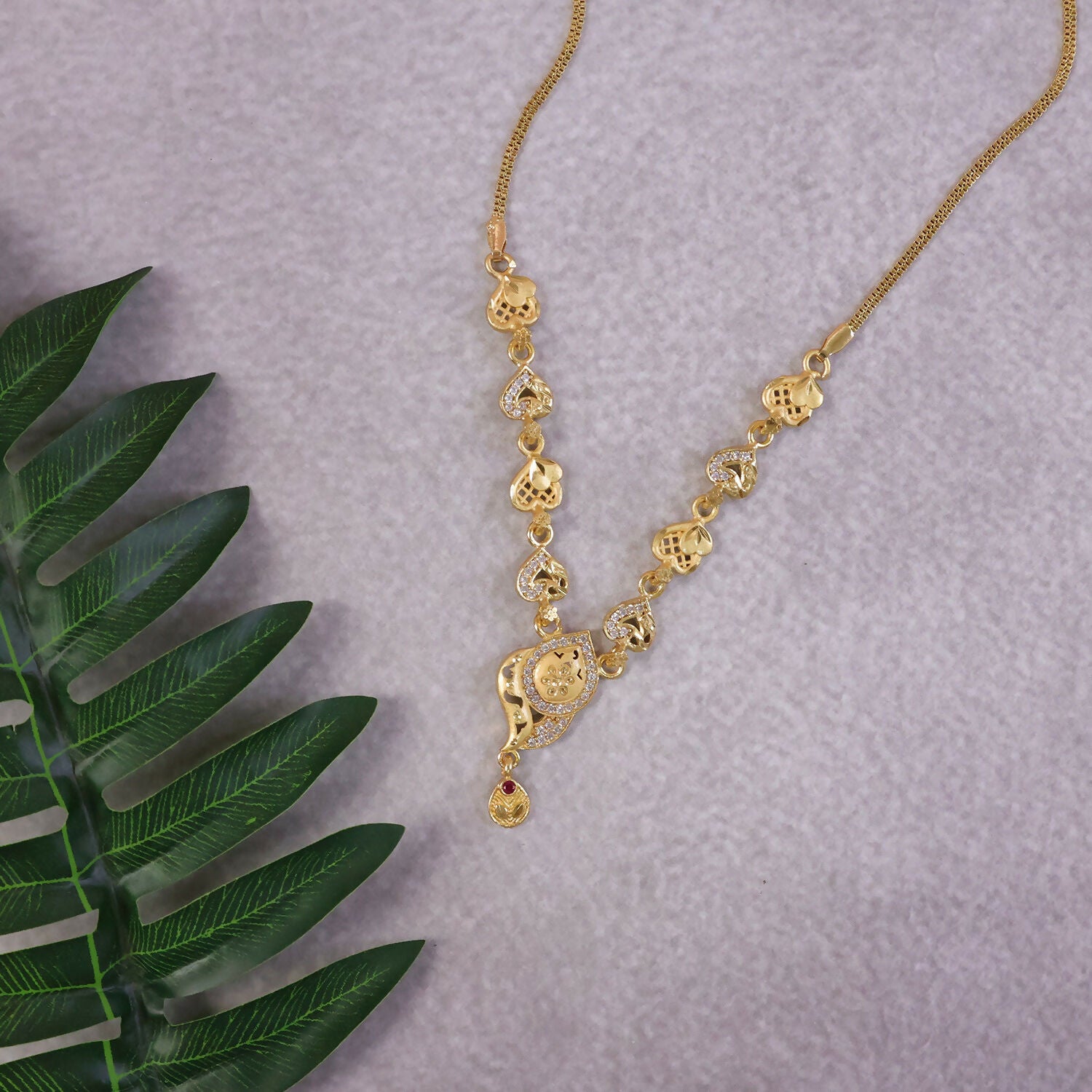 Elegant Gold-Tone Heart Motif Necklace Set with Designer Pendant & Matching Drop Earrings