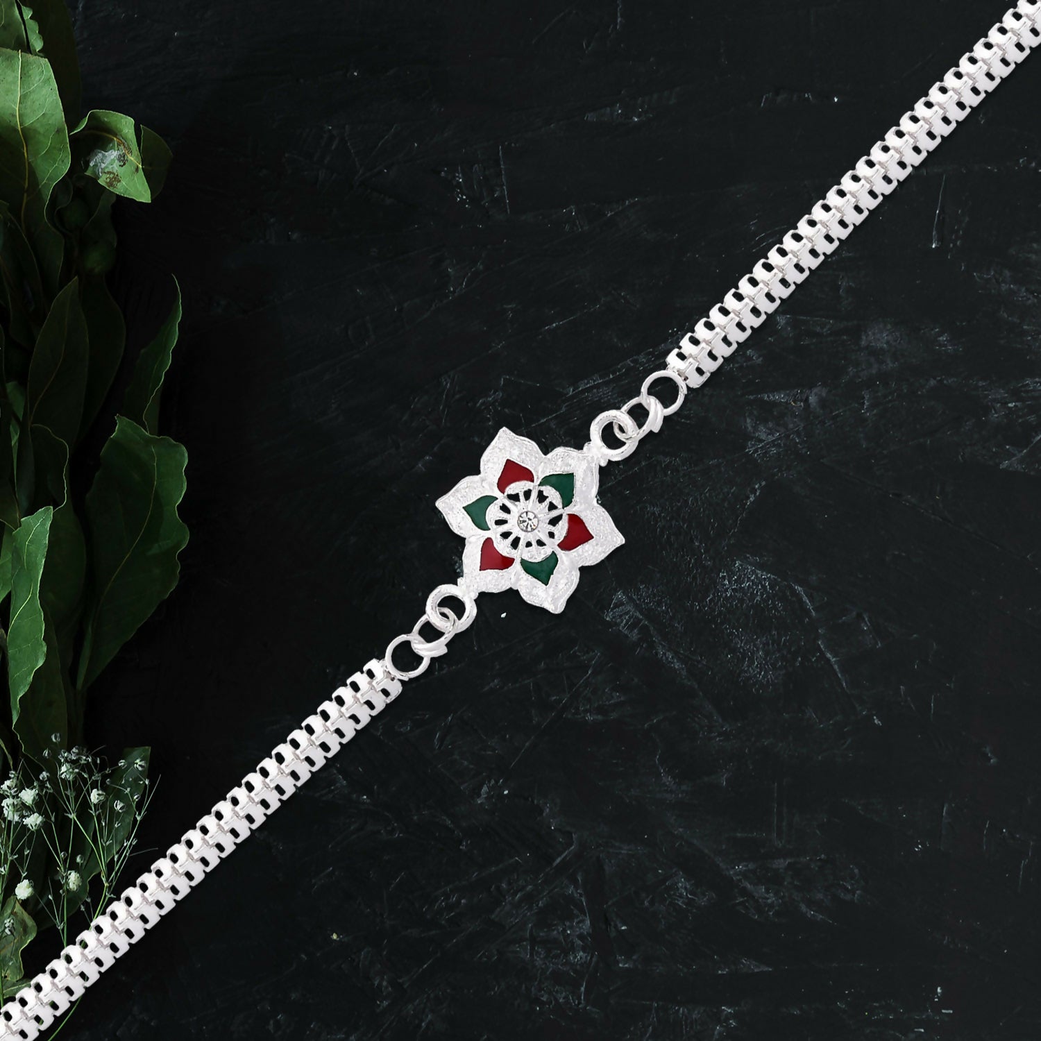 Silver Rakhi featuring elegant traditional design for Raksha Bandhan celebration