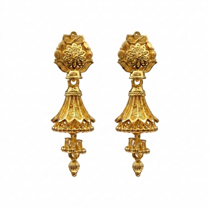 Model wearing traditional gold jhumki earrings