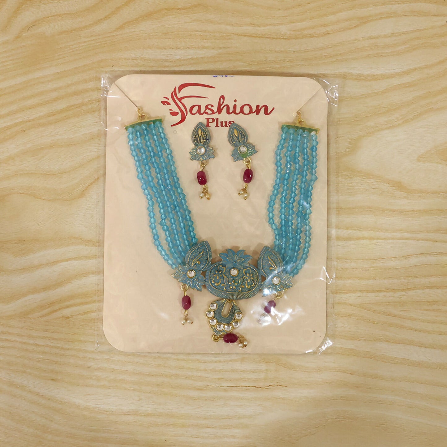 Matching earrings paired with sky beaded necklace set
