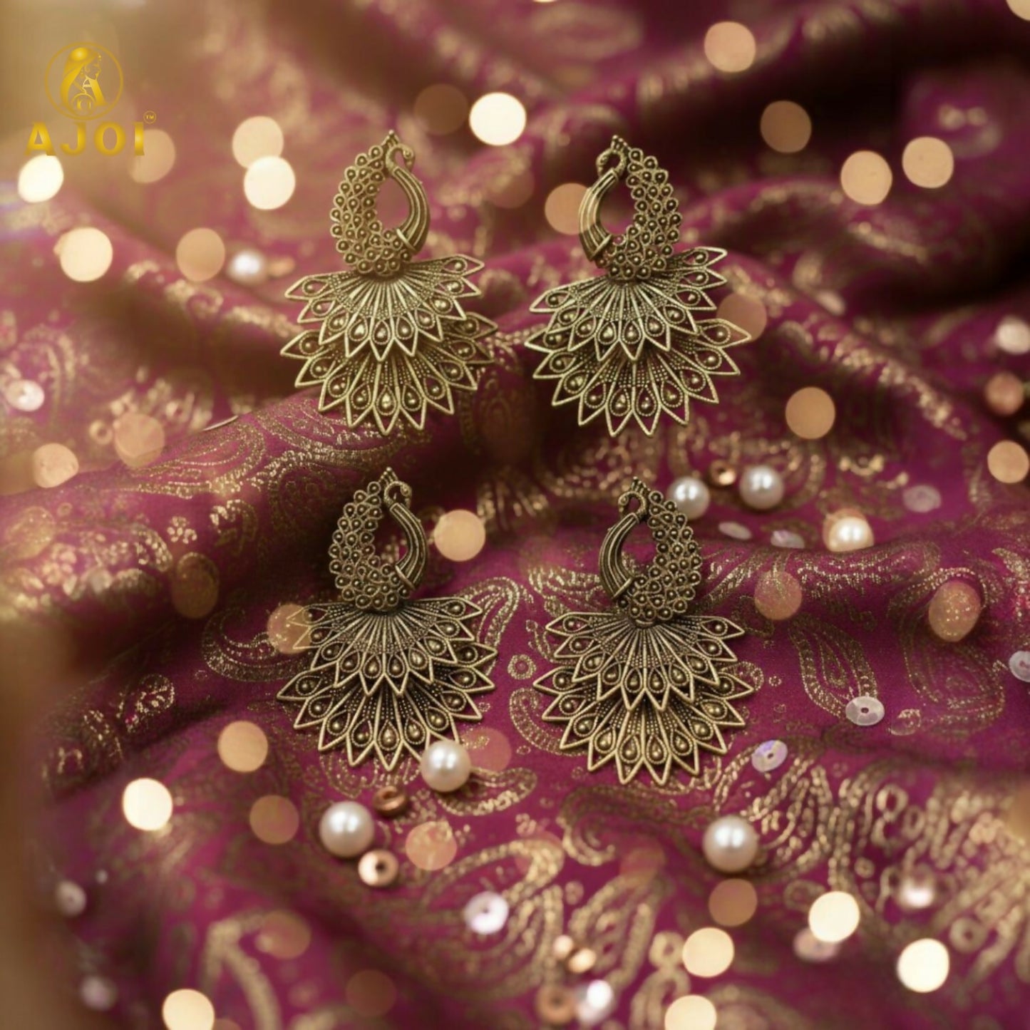 Side profile of peacock motif antique gold earrings
