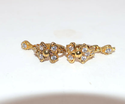 Gold plated swan motif huggie hoop earring with dangling cubic zirconia stone detail