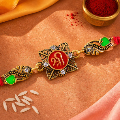 Antique Gold-Toned Shree Rakhi with Crystal Accents, Green Enamel & Designer Red Thread