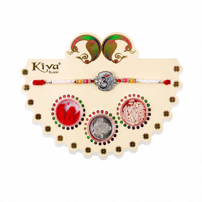 Om Symbol Silver Centre Rakhi with White Beads, Roli Chawal Coin and Peacock Gift Packing