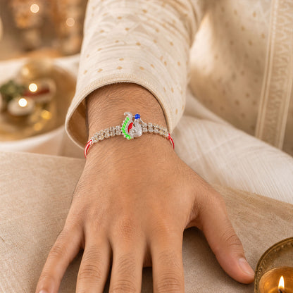 Festive Rakhi with Peacock Charm, pink accents and display look for Gift Styling