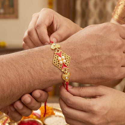 Royal Red Kundan Rakhi with Pearl Cluster and Gold Side Charms