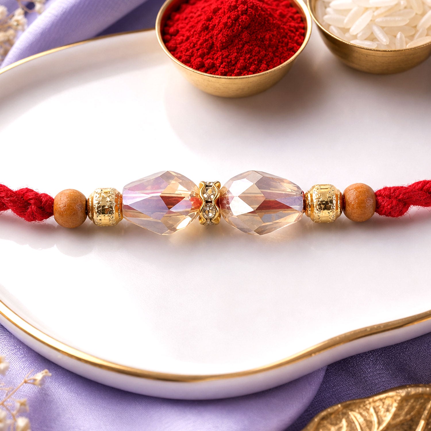 Red Thread Rakhi with Champagne Crystal Bead Pendant Accents