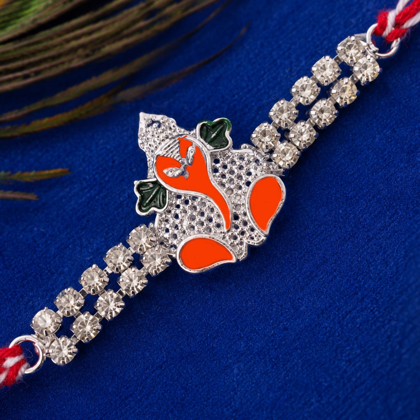 Silver-Toned Bal Ganesha Rakhi with Orange-Green Enamel, Double Crystal Chain & Red-White Thread