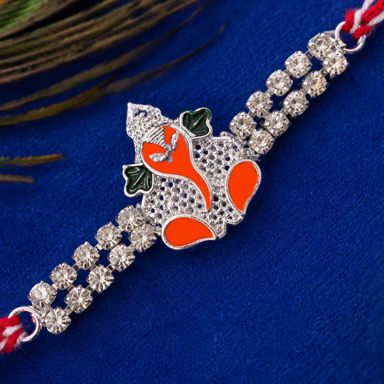 Silver-Toned Bal Ganesha Rakhi with Orange-Green Enamel, Double Crystal Chain & Red-White Thread
