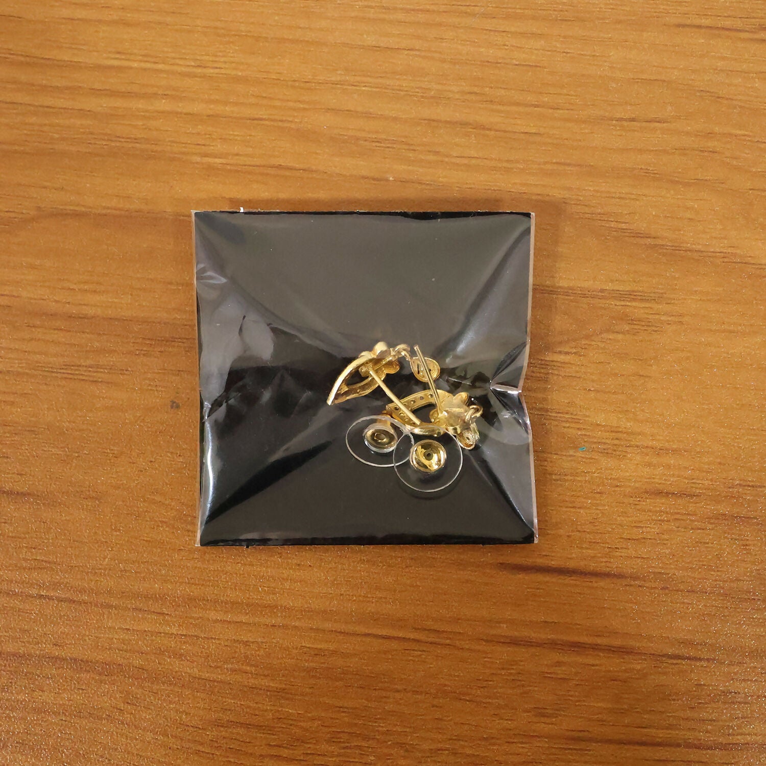 Modern Floral Gold Finish Stud Earrings With Polished Texture And Drop Accent