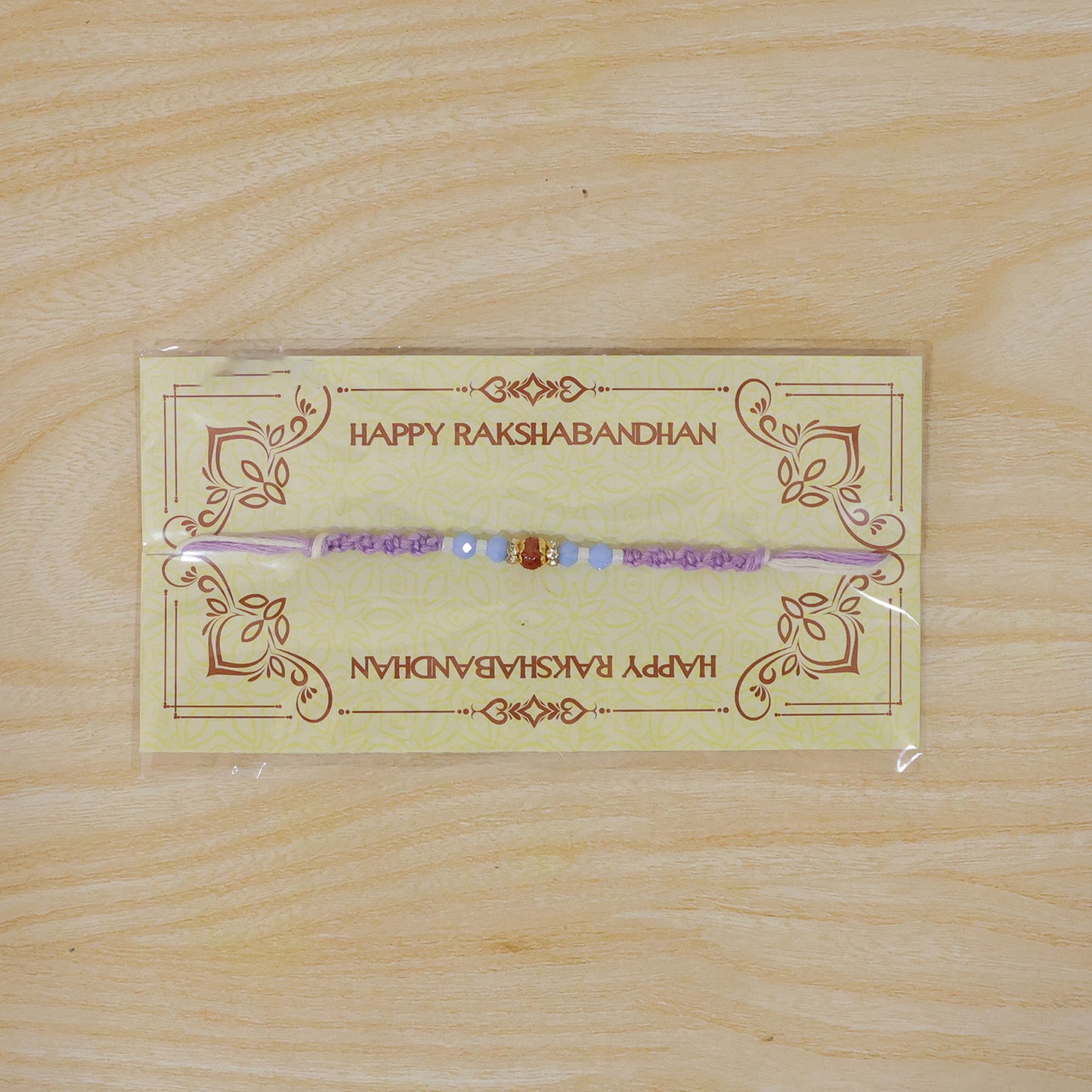 Sparkling Pearl Stone Rakhi with Colorful Thread and Premium Festive Beauty