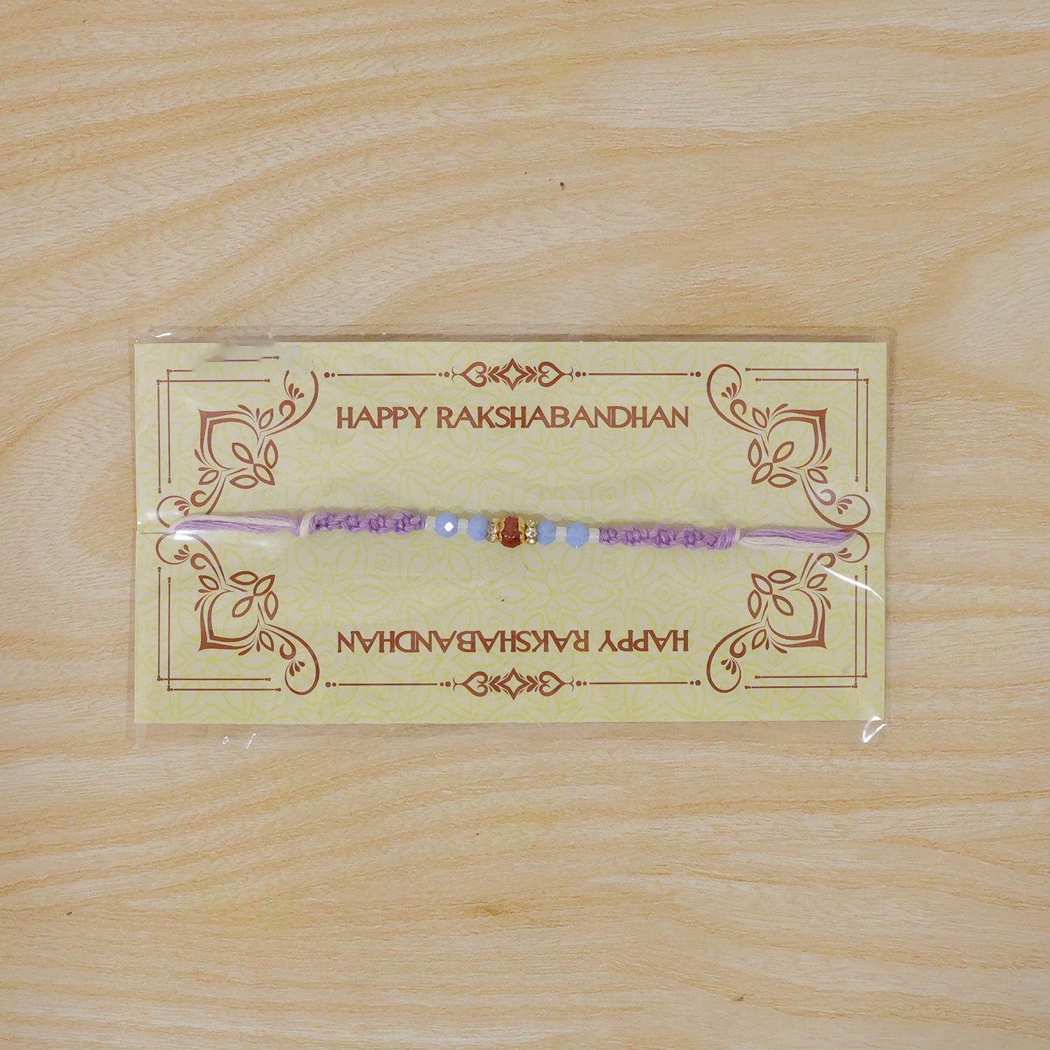 Sparkling Pearl Stone Rakhi with Colorful Thread and Premium Festive Beauty