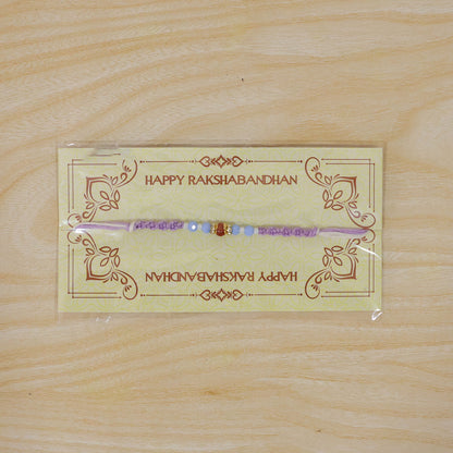 Sparkling Pearl Stone Rakhi with Colorful Thread and Premium Festive Beauty
