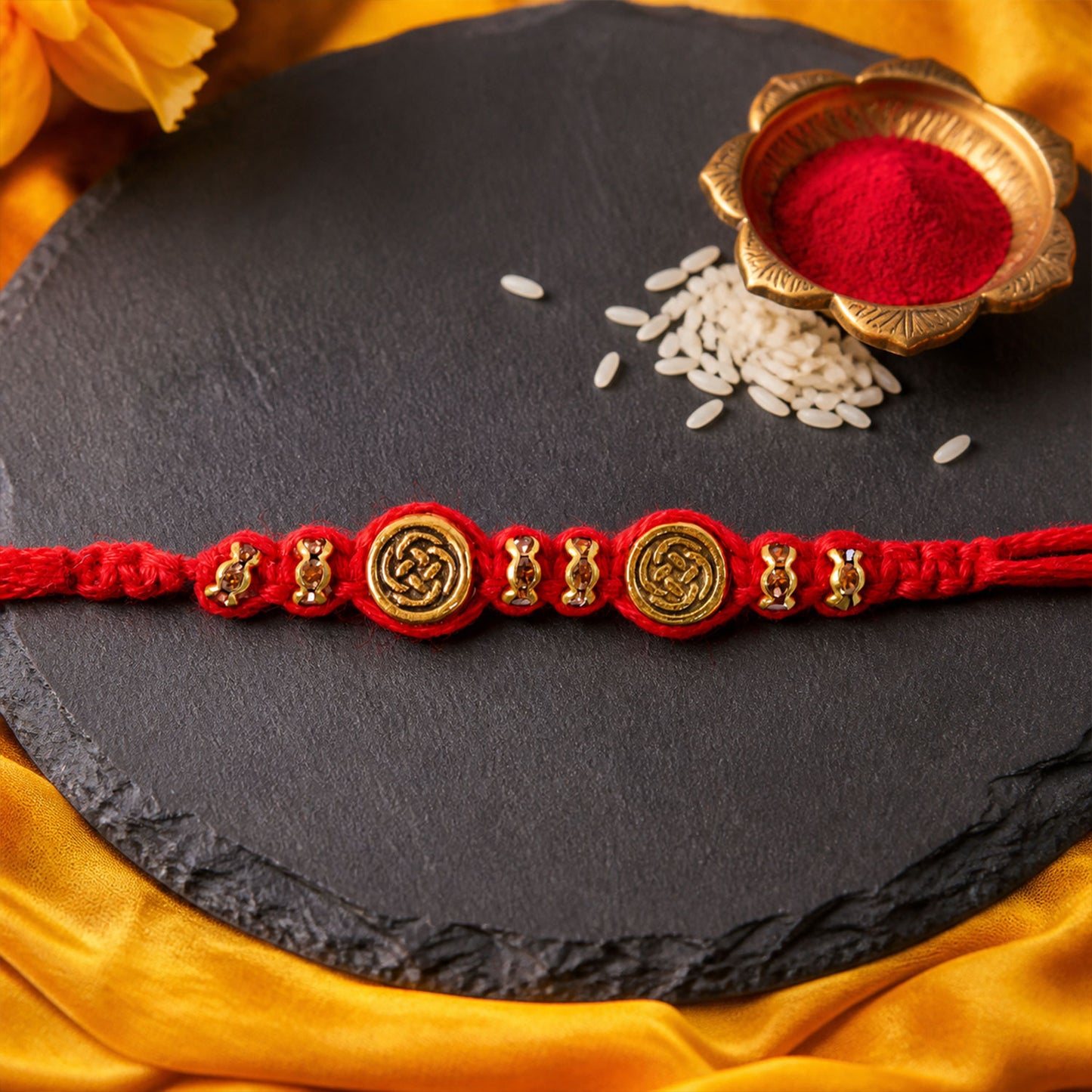 Red Braided Rakhi with a Row of Antique Gold Coin-Style Charms