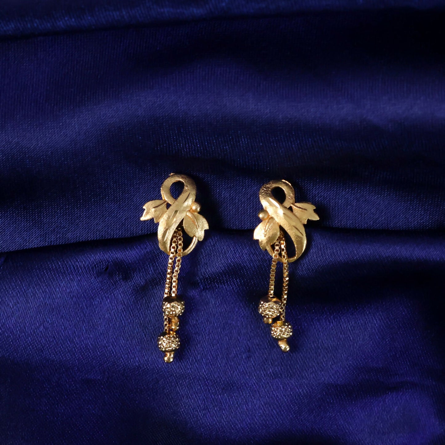 Regal Botanical Motif Gold Drop Earrings with Cascading Chain Bead Accents