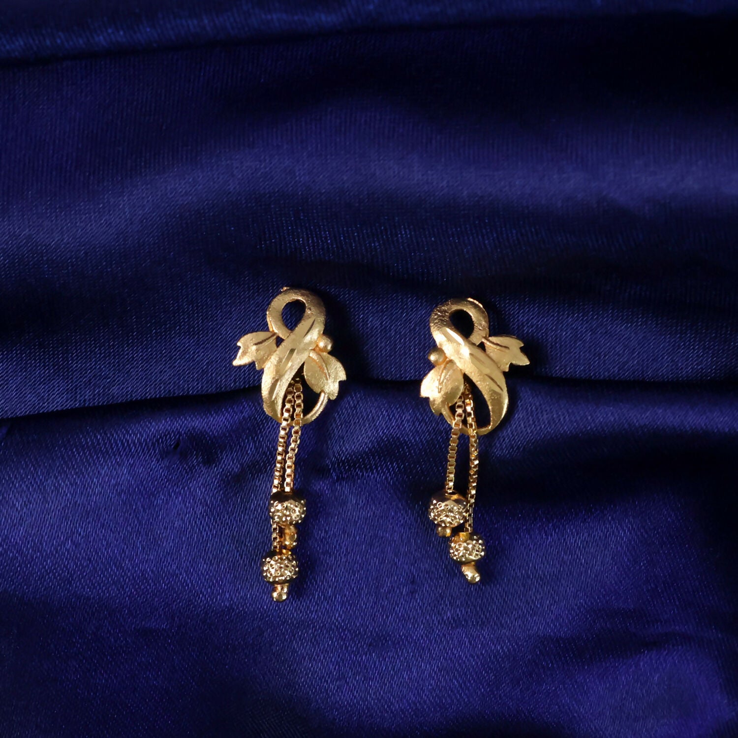 Regal Botanical Motif Gold Drop Earrings with Cascading Chain Bead Accents