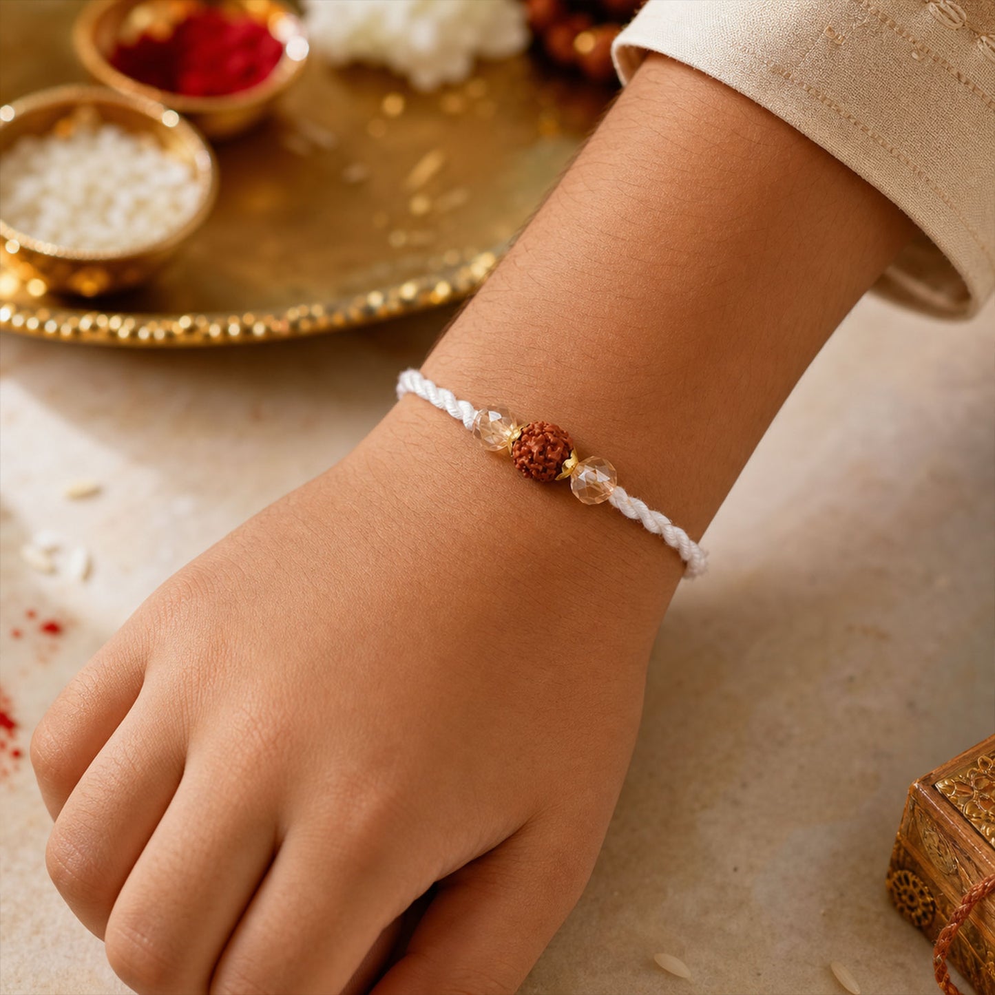 White-Red Thread Rakhi with Rudraksha and Sparkling Crystal Bead