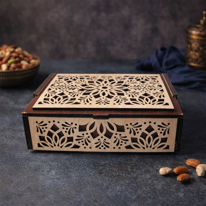 Open wooden dry fruit box showing four compartments filled with dry fruits