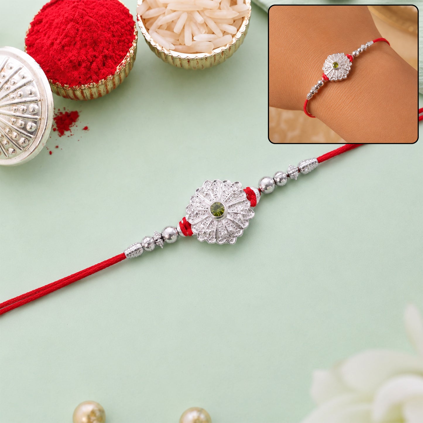 White Daisy Rakhi with Silver Beads and Soft Green Stone Center