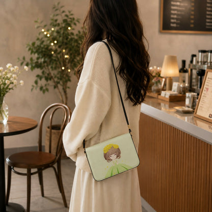 Side angle of green princess print crossbody bag