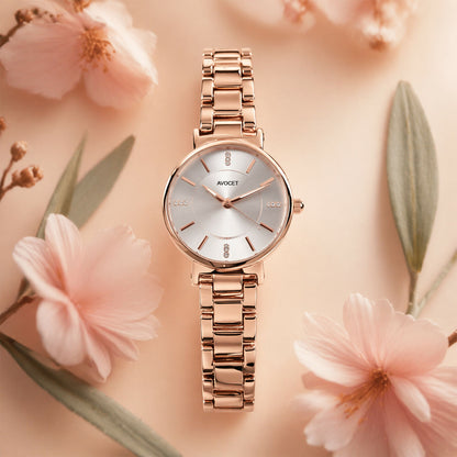 Close-up of rose gold watch dial with crystal details