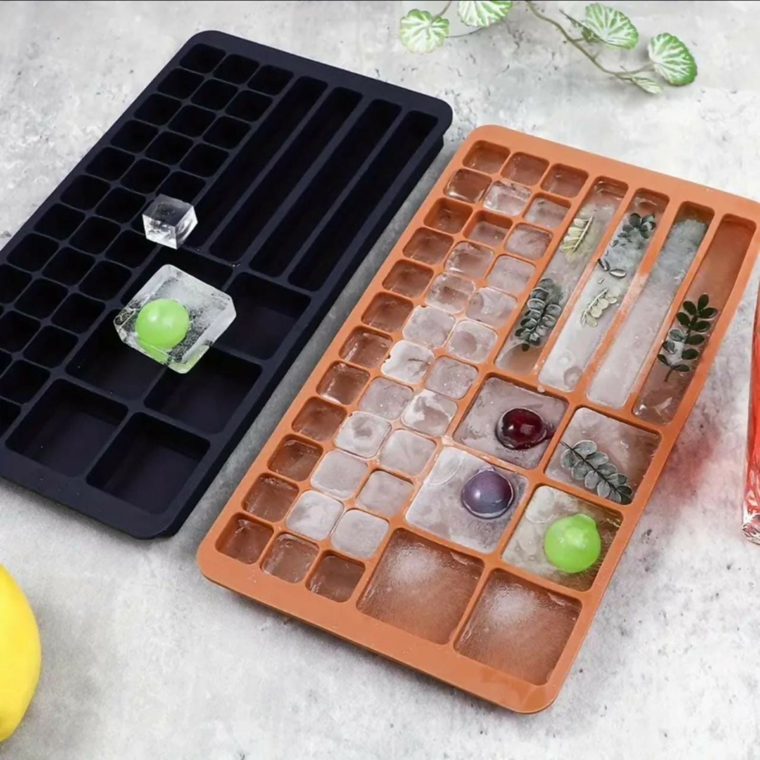 Close-up of flexible green silicone ice tray with square cubes
